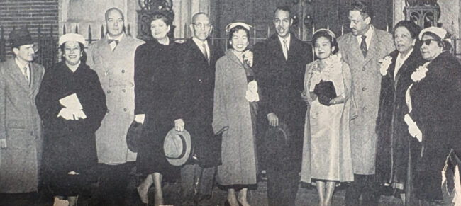 Bridal party poses outside St. Philip's Episcopal Church after ceremony. In group are: John Bridgewater; Mrs. Roy Wilkins; Charles Stovall; Mrs. Stovall; best man George Hilton; maid of honor Marilyn Mayekawa; NAACP executive secretary Roy Wilkins; the Marshalls; groom's mother, Mrs. Norma Marshall; Mrs. Medea Dodson.